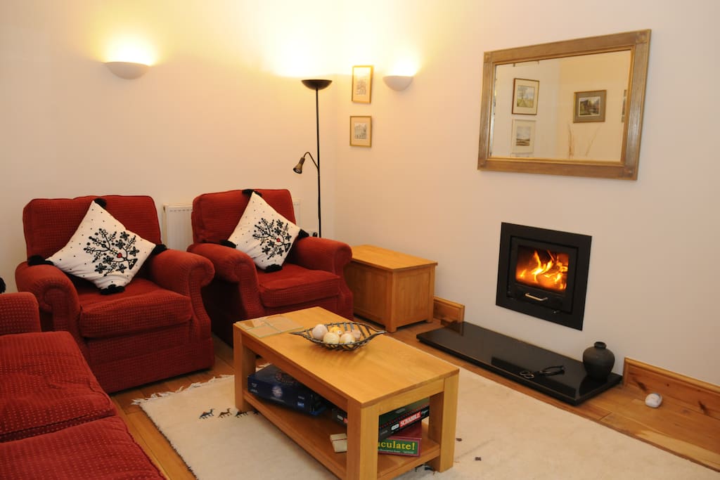 lounge with log burner for exclusive guest use
