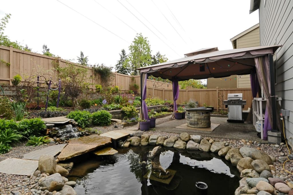 Swing, Barbeque grill, Fireplace, and Gazebo in backyard