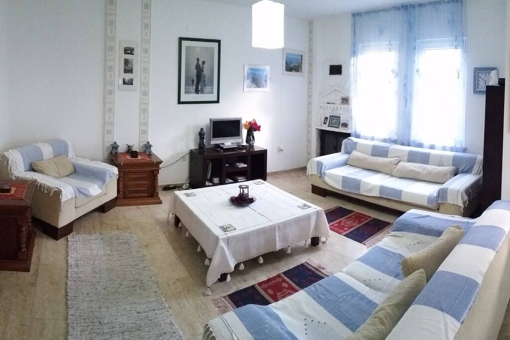 Living Room with Smart Large Screen TV, with DVD player and AC