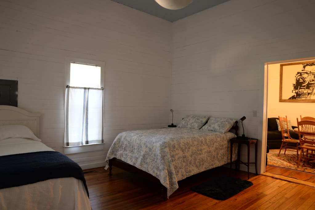 Bedroom with full and twin beds.