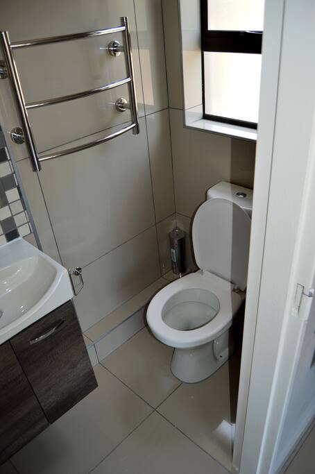 Room 2's en-suit bathroom. All bathrooms are equipped with heated towel rails making your stay that much more comfortable.
