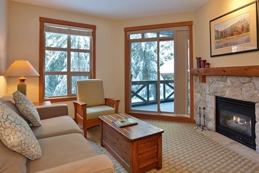 Lounge by the fireplace after a day in the mountains