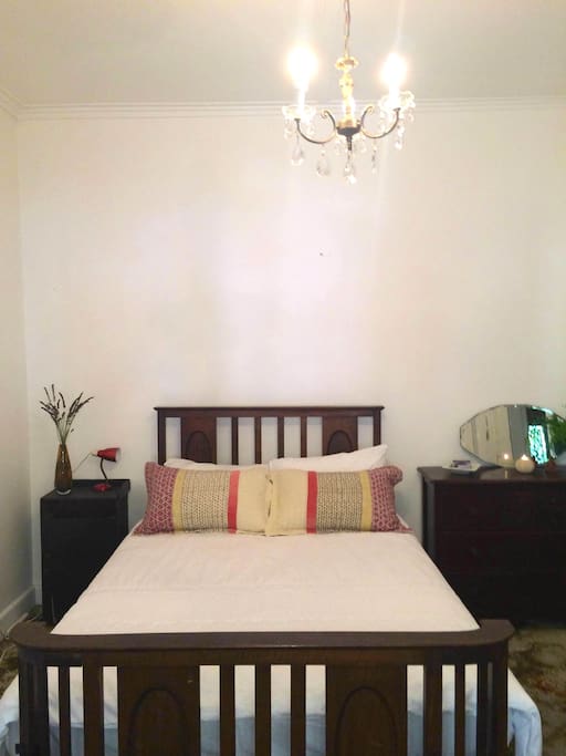 Queen size, comfy antique bed and chest of drawers.