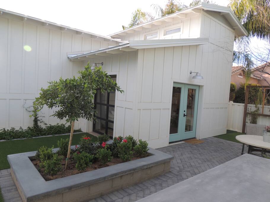 Your Barn Bungalow with french doors and roll up large door windows.