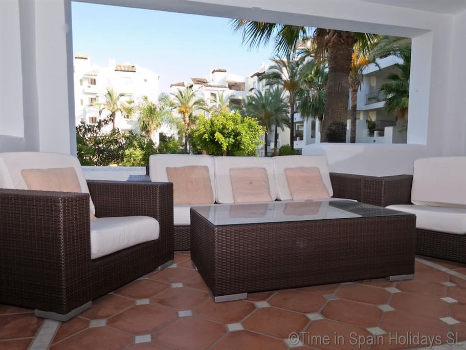 Modern furniture on covered terrace