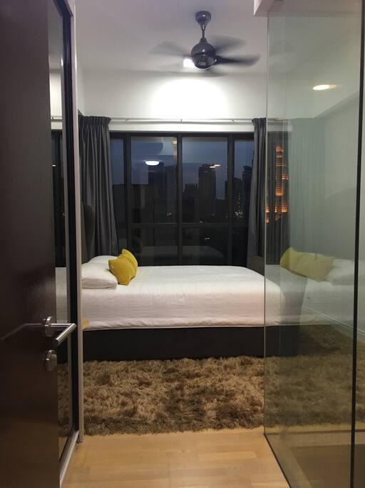Entrance to the main bedroom with real bed (you wouldn't want to get up trust me), wardrobe, aircon and fan plus master bathroom