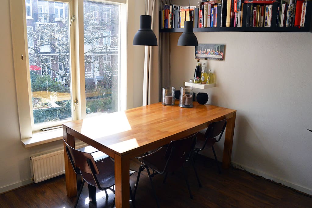 Enjoy your own prepared meal on this bright dinner table with a lovely garden view