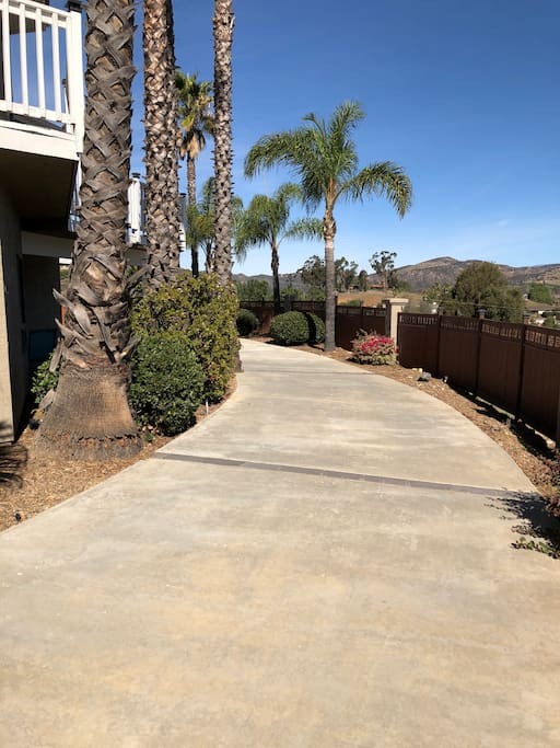 Take the driveway around toward the suite and parking