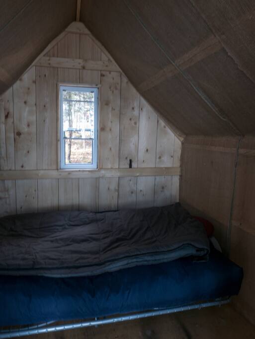 Cozy interior with one double or two single beds.