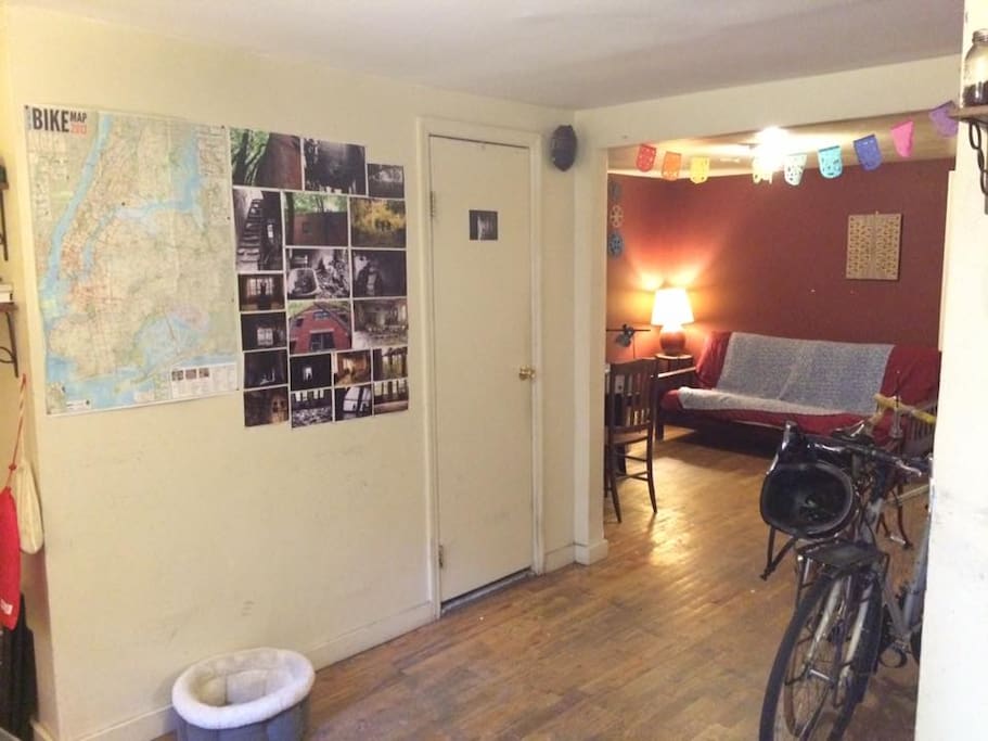 large NYC bicycle map to help you navigate on your cite-bike from the corner / futon for lounging in the shared space