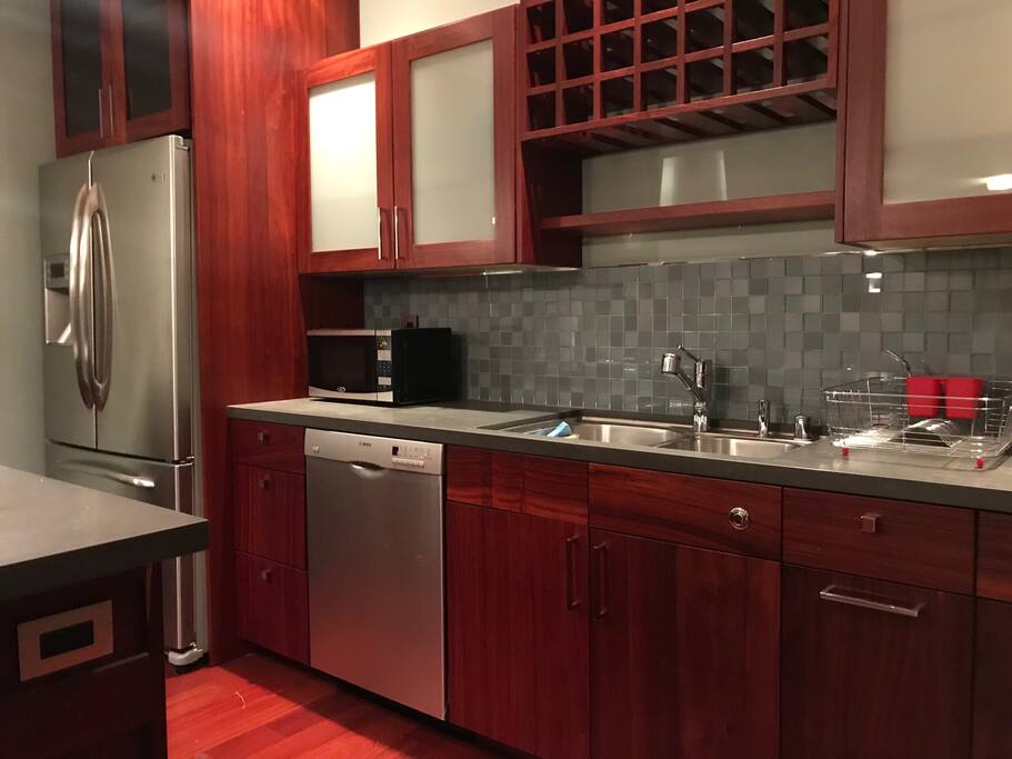 Full sized refrigerator and dishwasher.