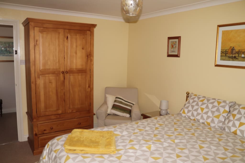 Room showing wardroom & armchair