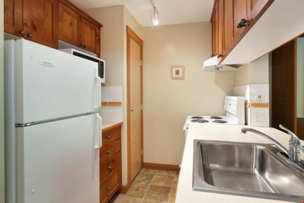 The fully-equipped kitchen provides everything you need to cook your meals in the privacy of your suite.