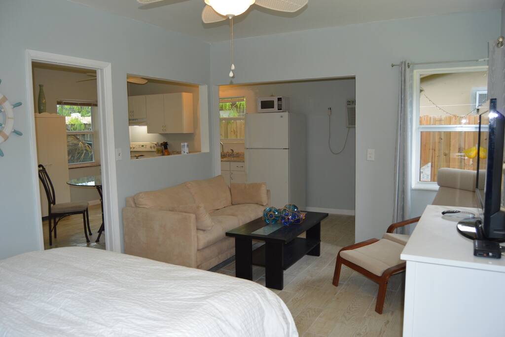 Sitting area with pull out couch and coffee table.