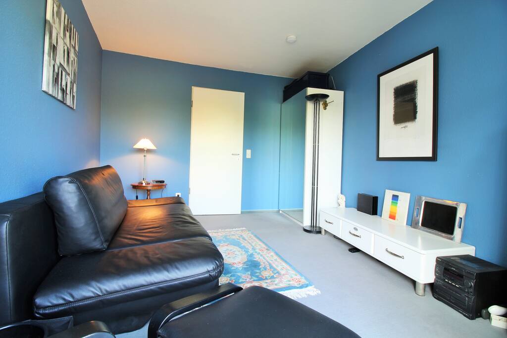 The room is bright and has a friendly blue design.