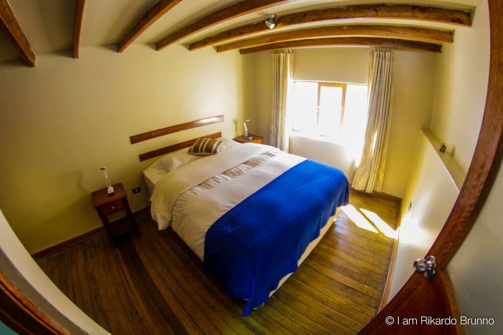 The master bedroom has a queen size bed and a walk-in closet. The bedroom has a window that overlooks a quiet street.