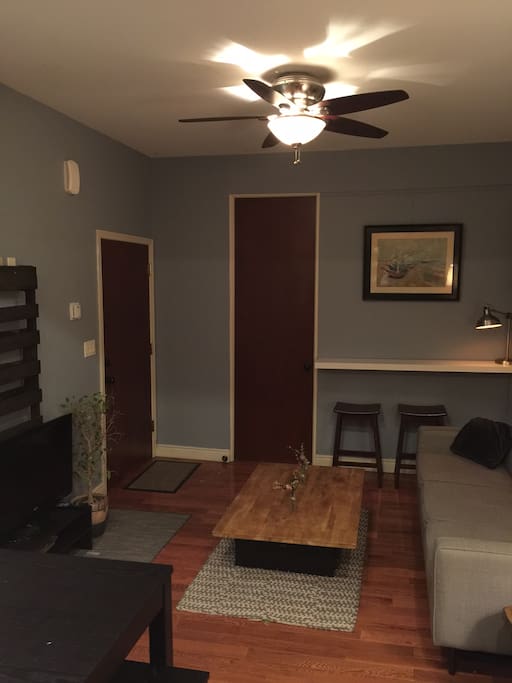 Door on the left is front door, door on right is to front bedroom.