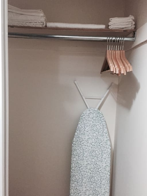 Closet with ironing board and iron (not pictured)