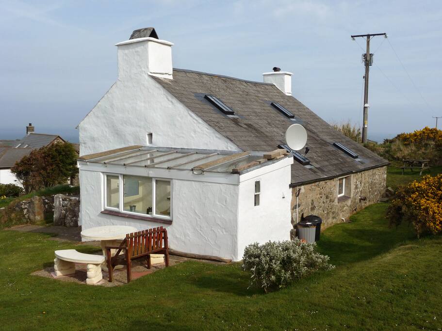 Side view of cottage - lawns surround the cottage