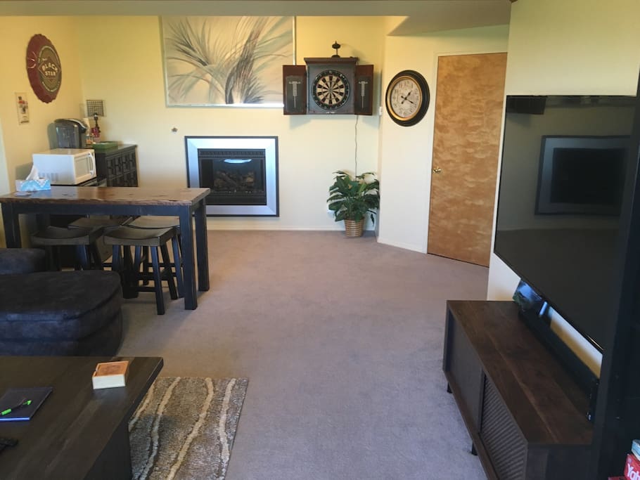 Family room: microwave, fridge, and bar in far left corner.