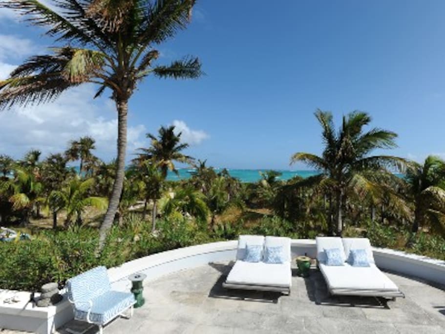 Patio with ocean views, 100 feet from your pink-sand beach.
