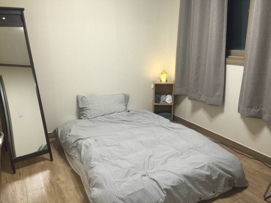 This is your room! (queen size-couple option) Super comfy down comforter on top and nice room darkening curtains.