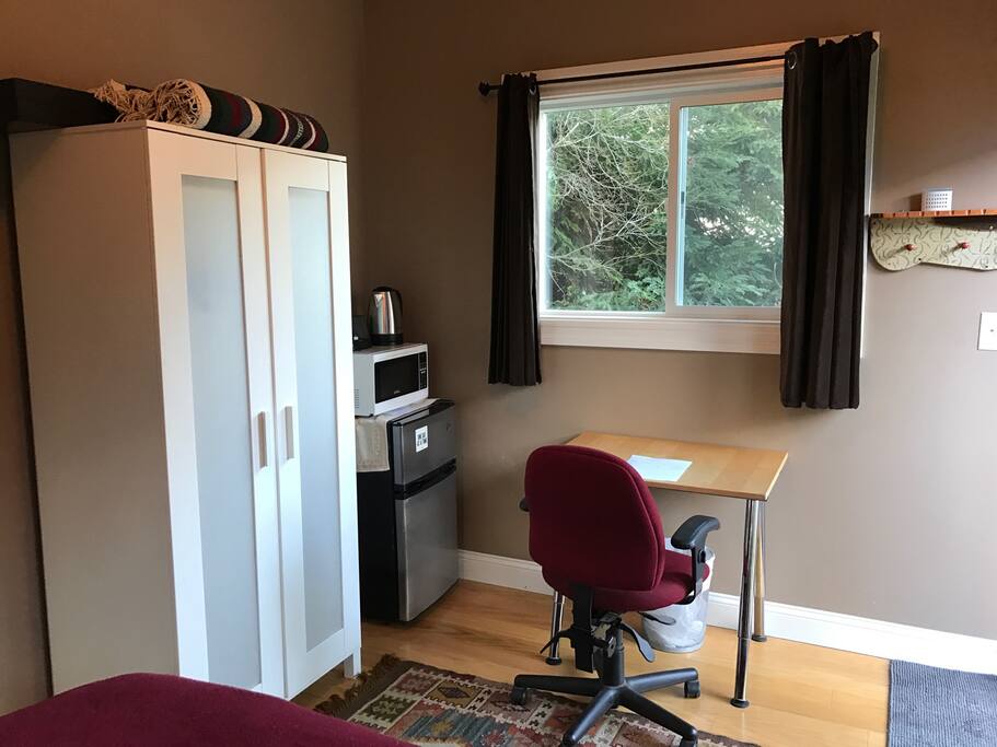 Desk, refrigerator and microwave with lots of natural light!