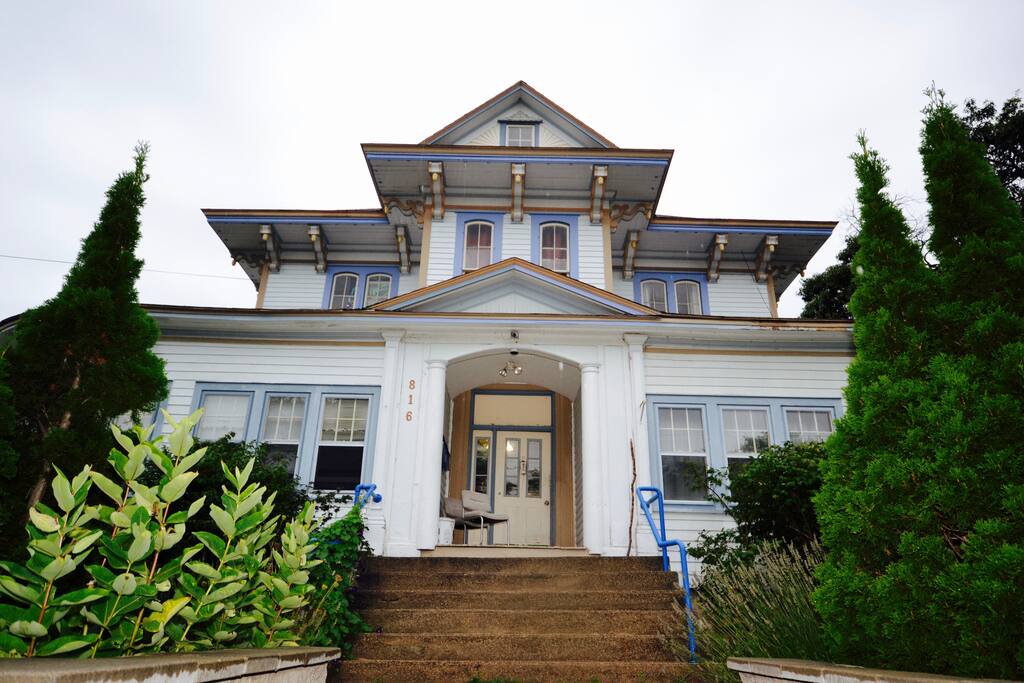 This is the front entrance to the house, shot August. Guests should park in front of the stone wall.