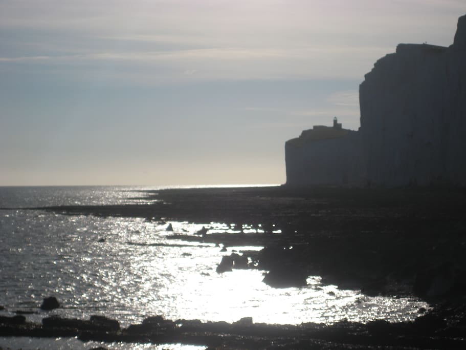Walks at sunset under the clifftops.