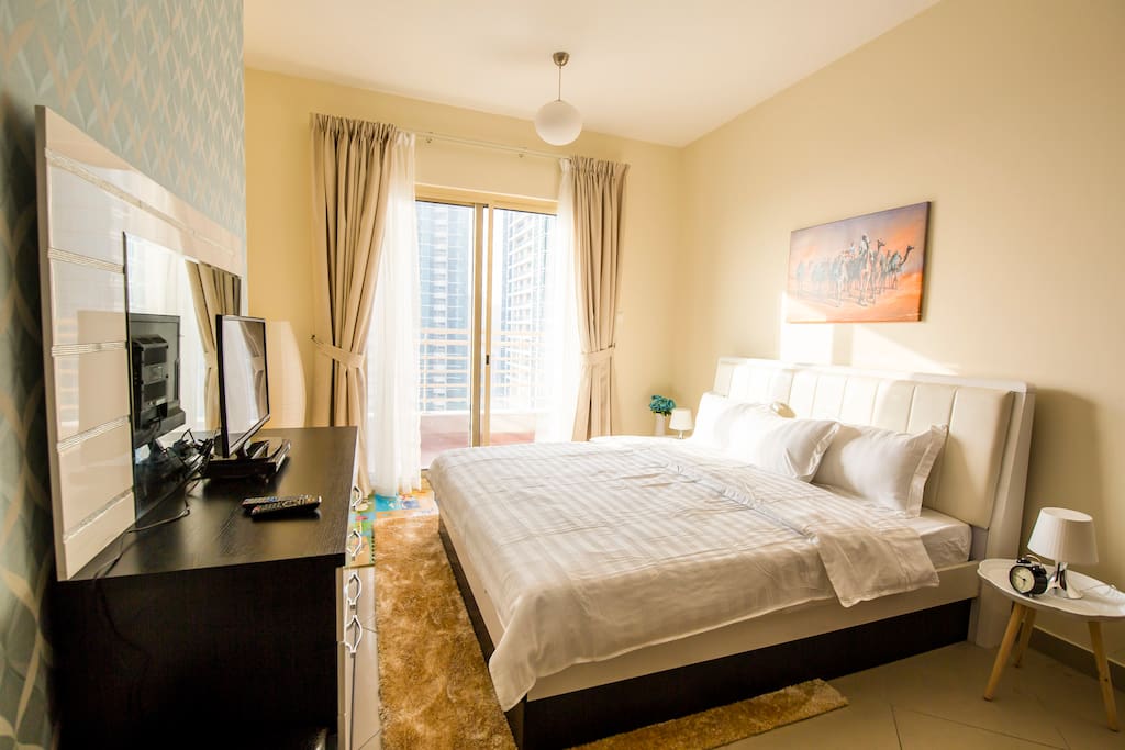 Sleep well in the large master bedroom with separate balcony, TV and DVD player. King bed (sleeps 2).