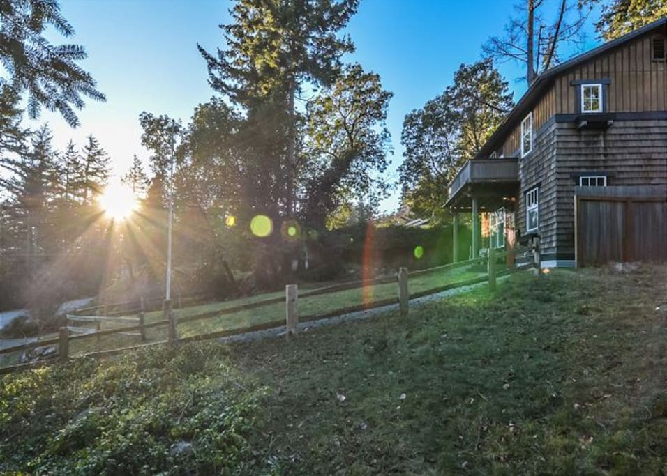 This cedar shakehome is perched on a hillside less than a half mile away from the sleepy village of Eastsound.