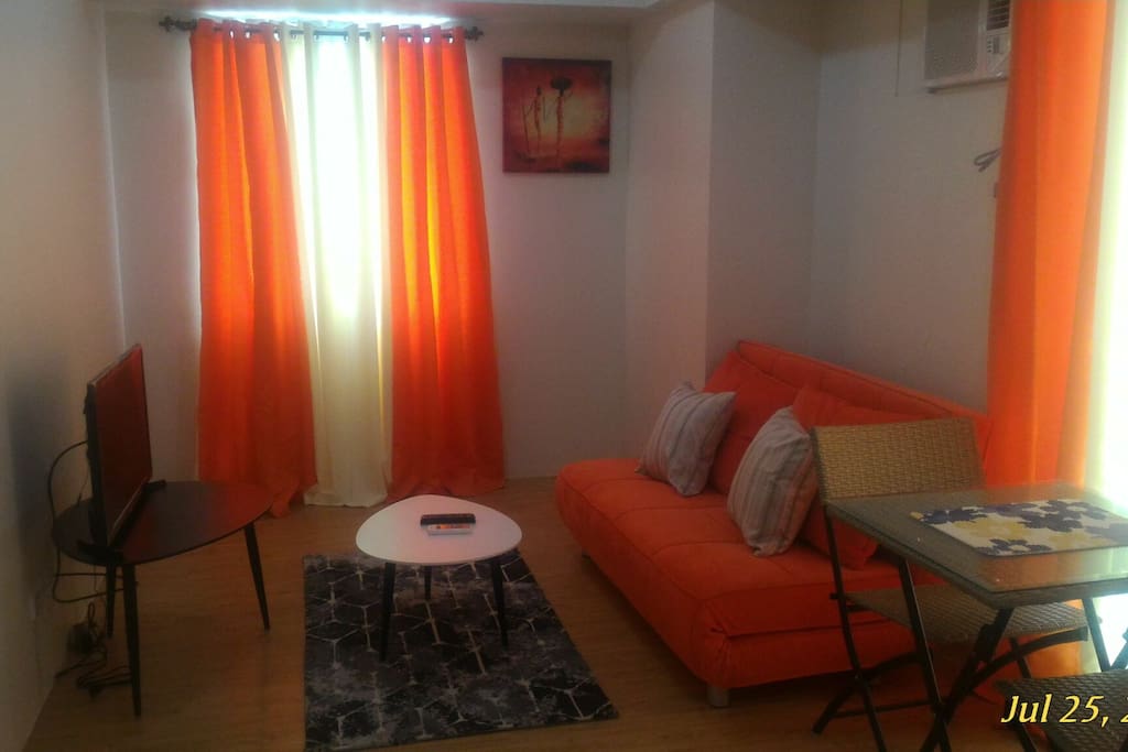 Sala space with sofa bed led tv