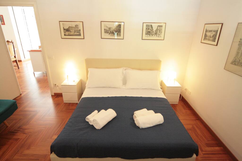 The first room, with french windows air conditioning and painted ceiling