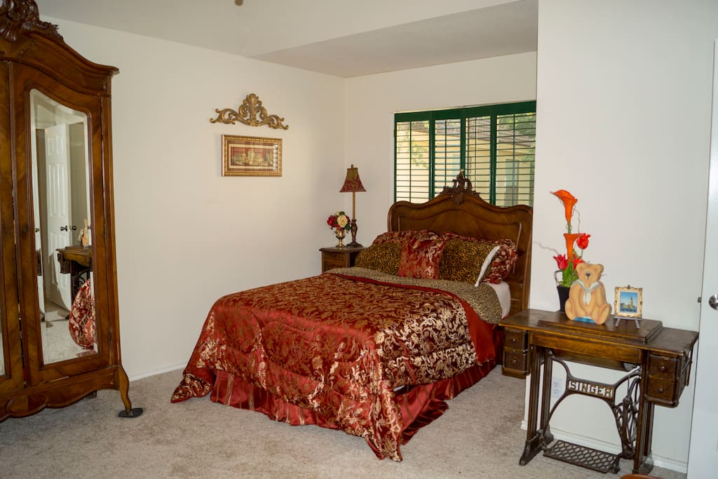 Spacious bedroom with niche for cozy bed, sitting area and enormous double walk in closets