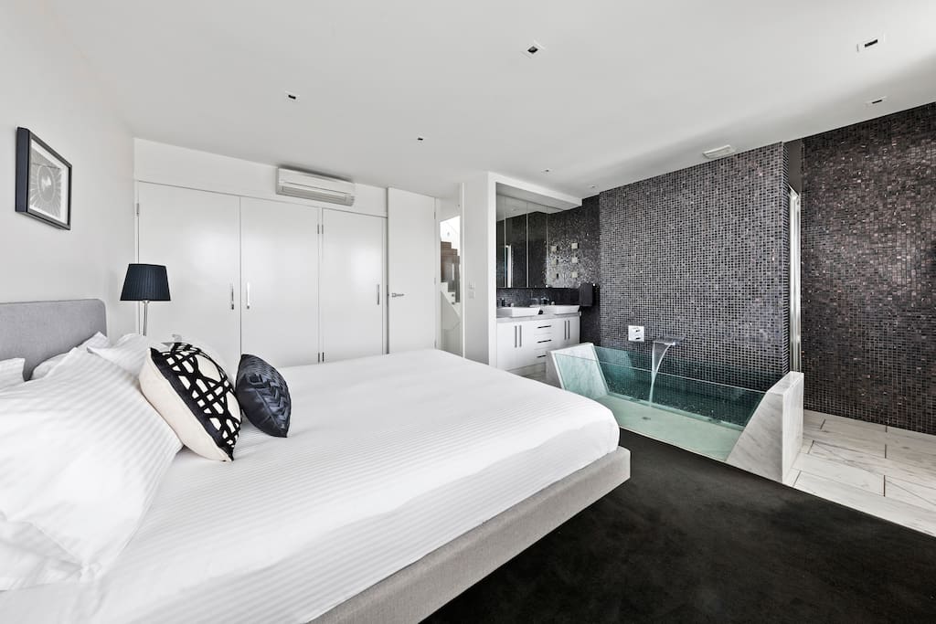 Enjoy the ensuite bathroom with double shower and glass bath!