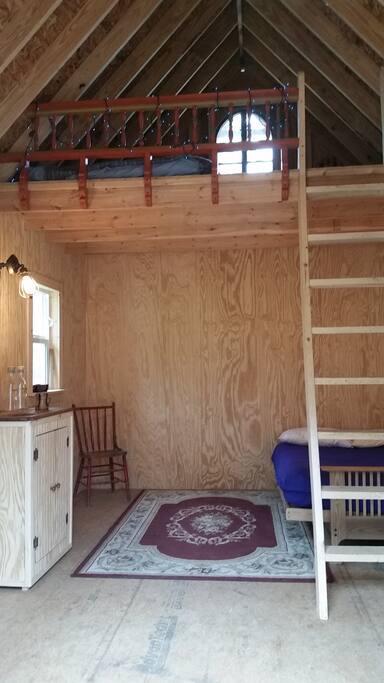Electric lights, ceiling fan, dry sink, hot pot, containers of water. Composting tiolet, rolling privacy wall.