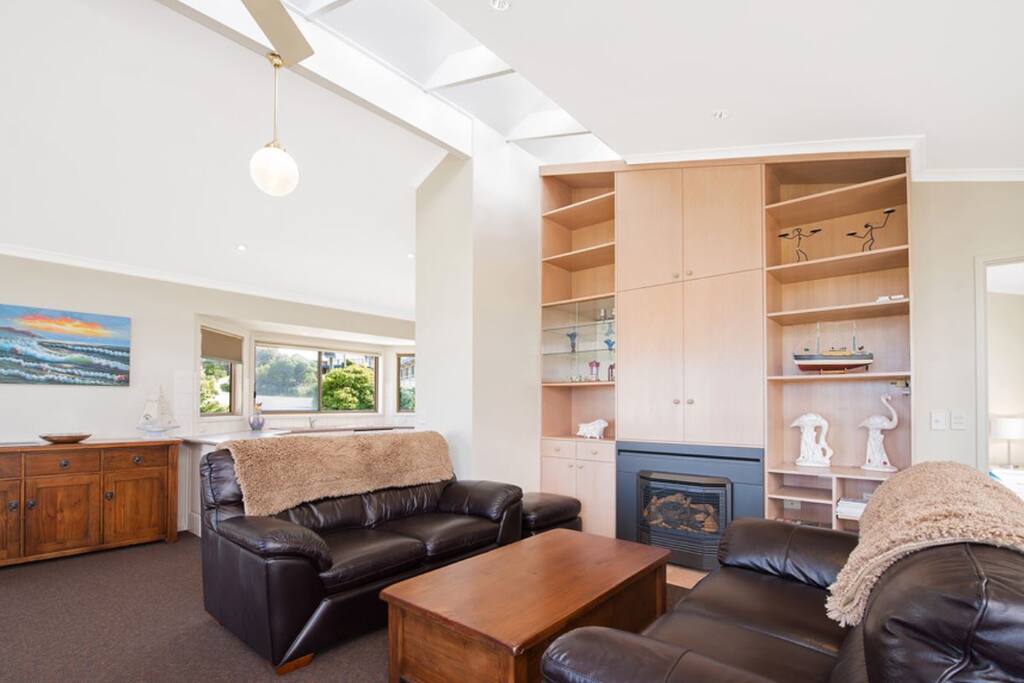 High ceilings and quality furniture make this lounge room a delight