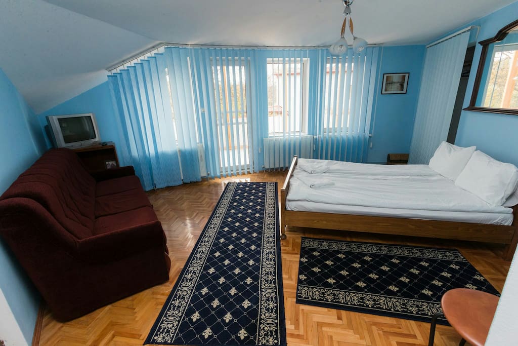 The room no 4 is painted in a beautiful blue colour. It has one large bed and one sofa. It's perfect for family with children, or for a nice couple. The room has private bathroom, a large balcony, TV, tv cable, free WiFi.
