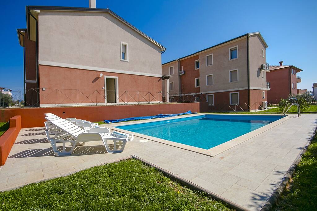 Swimming pool and ap.building