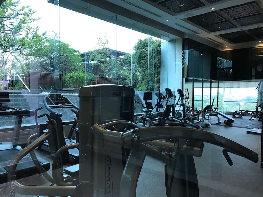 Gym with shower facilities and pool on same level.