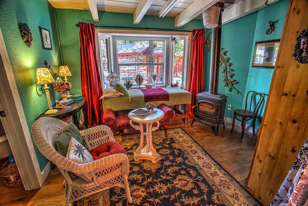 Sitting room adjacent to bathroom... muse in front of gas stove and quintessential 1920's cabins adjacent