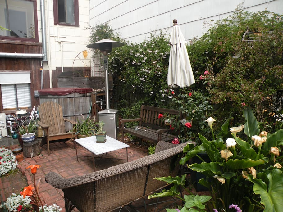 Lovely sitting area in garden with heater.