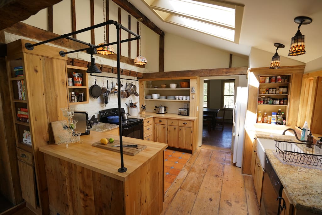 Sun-filled country kitchen with plenty of pots, pans, and spices to get you cooking.