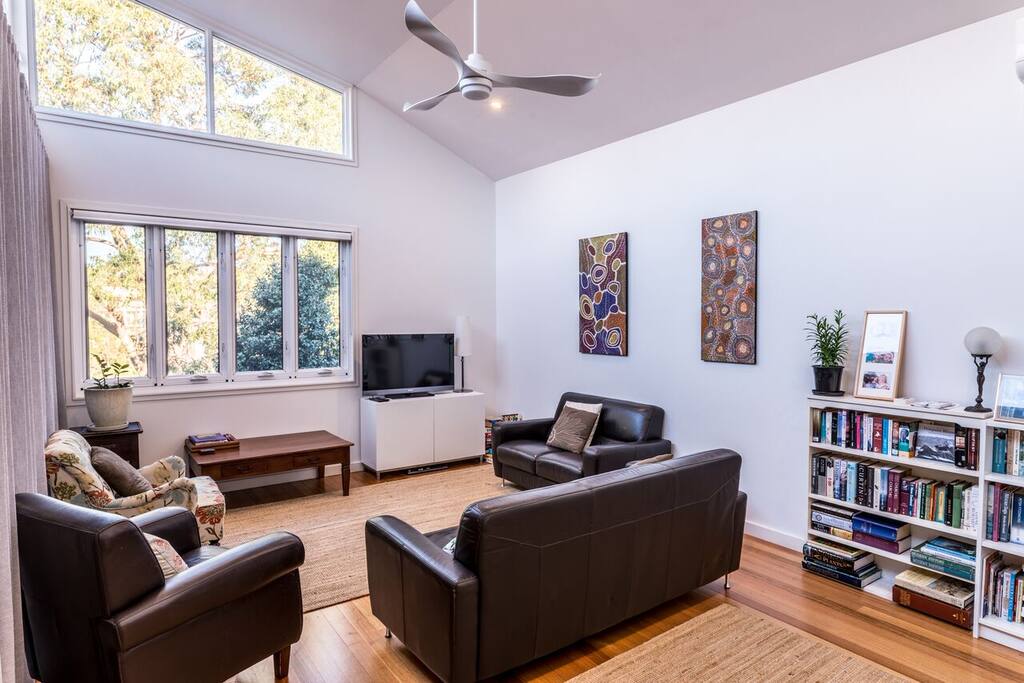 Large lounge area with high ceiling and natural light.