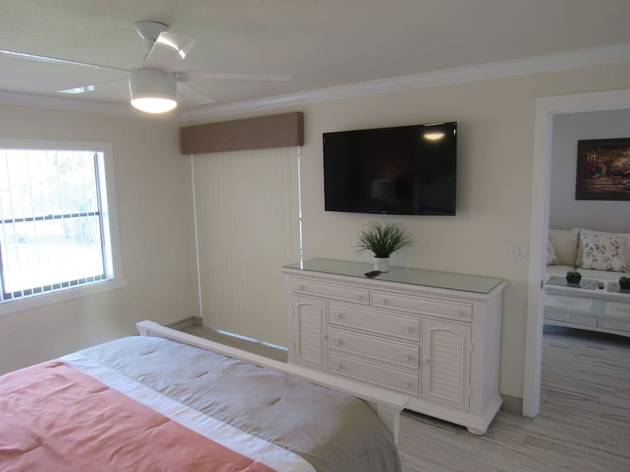 Mounted flat screen TV in master bedroom