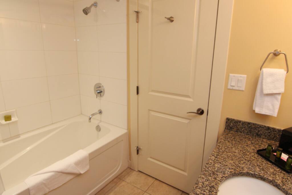 Get ready in the beautiful modern bathroom with a shower and tub combination