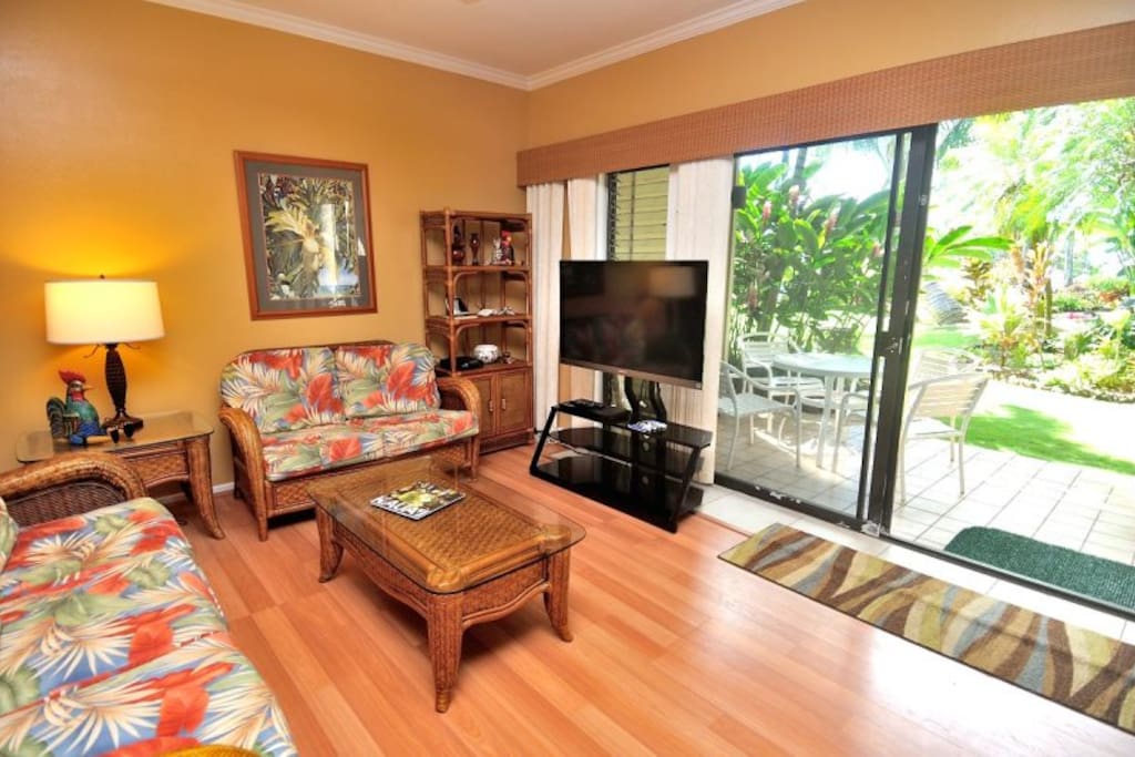 Living area looking out to pool and beach