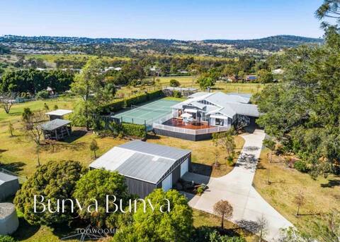 Luxury Estate set over 2 acres  w/ Tennis Court