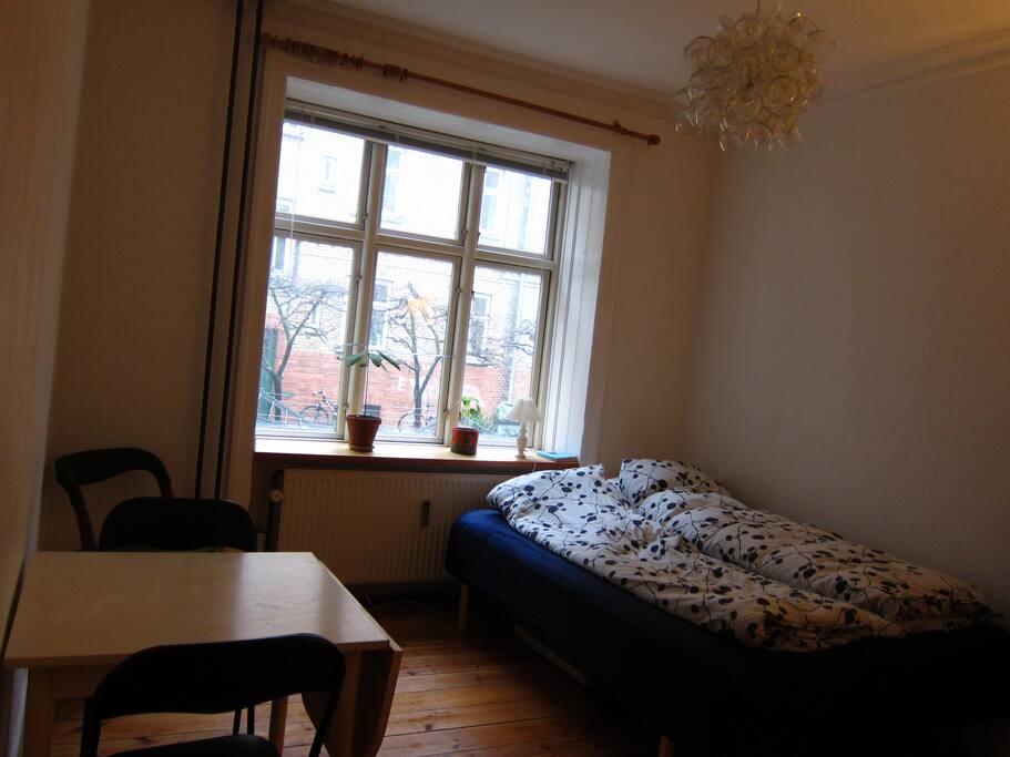 Enough room for a double bed and a table with chairs