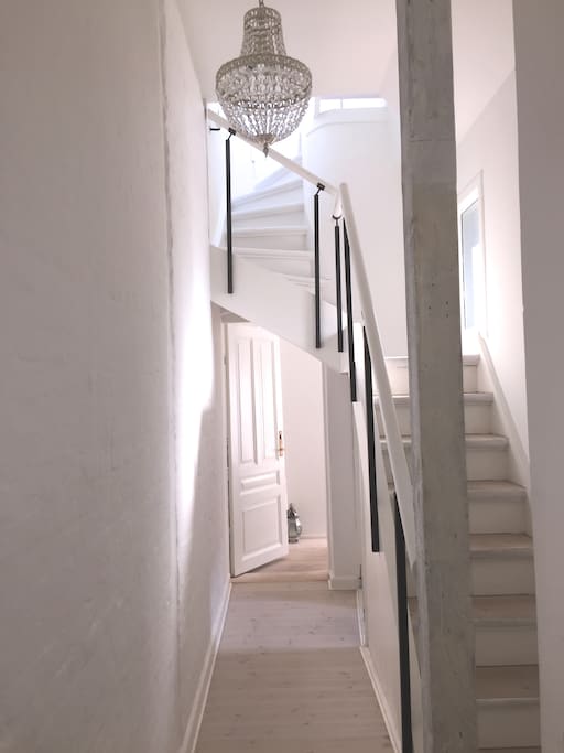 Stairs to roof terrace and hall to bedroom.